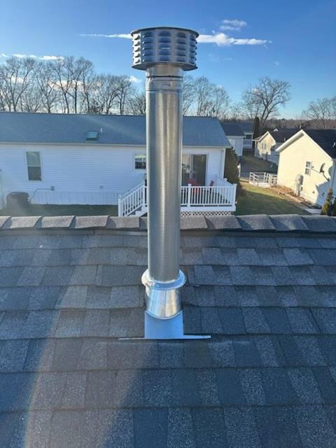 Installation of a  B-vent metal chimney system. The five-inch inner venting wall will match the take-off size on top of the newly installed natural gas furnace.