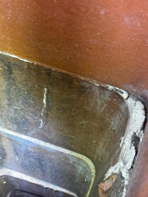 Sandy Hook flue tiles with vertical cracking , with separation in offset liner tiles. Installed a gas tight stainless steel venting system. 