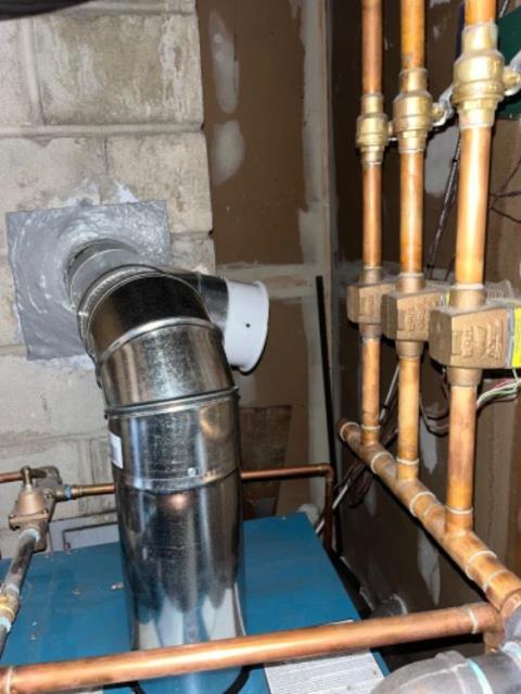 Sandy Hook flue tiles with vertical cracking , with separation in offset liner tiles. Installed a gas tight stainless steel venting system. 