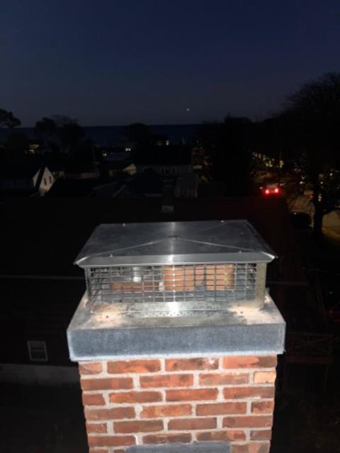 West Haven Ct Chimney cap was missing lid , allowing water into fireplace , and the furnace liner was uncapped altogether. Replaced with a stainless steel multi-flue chim-cap.