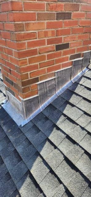 In Ellington, CT, the original chimney counter flashing is failing, allowing water entry, which has caused ceiling staining above the wood stove. Replacing the flashing with new lead, properly tucked and cemented in place with a waterproof cement, will prevent further water damage to the roof, walls, and ceilings.