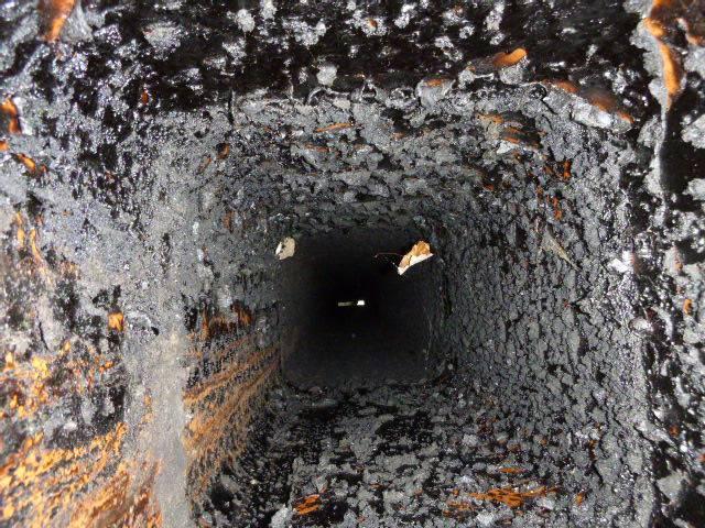 In Glastonbury, CT, Level One inspection found the fireplace venting system is coated with a solid stage 3 creosote glaze. Stage 3 creosote is very hard, dense and combustible, It's also the only form of creosote not removable via a standard sweep. This fireplace chimney needs a very aggressive cleaning with steel whips, 5-ft steel rods, heavy duty drill and rotospun off at 1400 RPM.