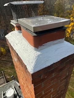 In Suffield, CT, the fractured and lifted cement crown needed to be re-mortared with waterproof cement to prevent further damage to the lower masonry structure from water intrusion.