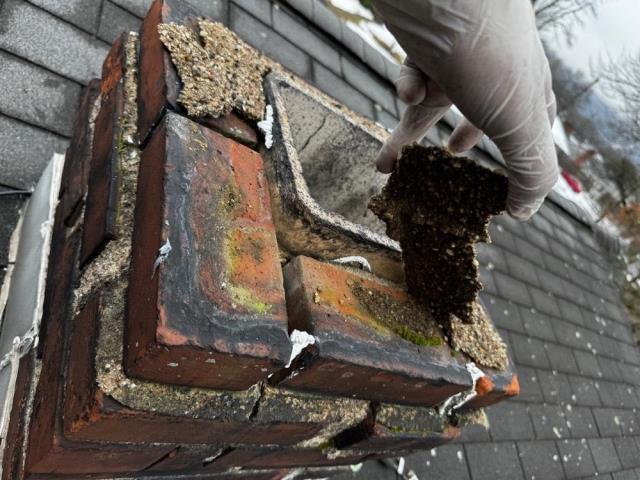 This chimney in Bristol CT had moss growth, loose bricks, and missing mortar. Safeside Chimney did a roof up rebuild to restore the chimney to its original condition.