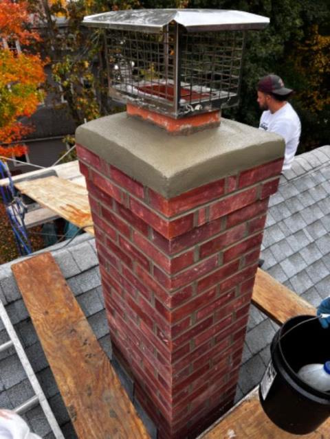 This chimney in Putnam, CT, had loose bricks and missing mortar, and sustained damages to the chimney from the outside. We rebuilt this one from the roof up, including new flashing, cap, and crown.