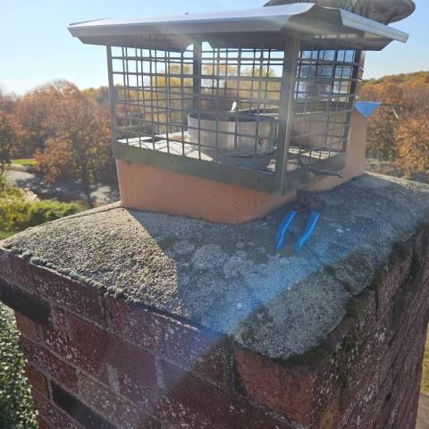 Seymour, CT, chimney crown was cracked and lifted, allowing water entry. Safeside Chimney poured a new crown to limit further water damage over time.