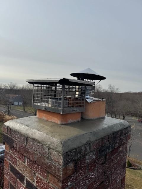 Seymour, CT, chimney crown was cracked and lifted, allowing water entry. Safeside Chimney poured a new crown to limit further water damage over time.