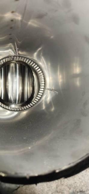 The furnace exhaust is condensing and creating acidic moisture, damaging the chimney and neighboring fireplace. Installing a 316L stainless steel 2-ply smooth wall liner will ensure safe venting and protect the structure.