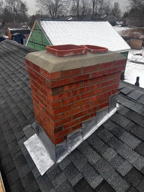 Enfield Ct chimney had cracked and broken liner tiles at top , the flashing and roof had a homeowner style spot repair done in past that wasn’t effective.  Rebuilt chimney roof up  with new flashing , masonry , flue tiles and cap.