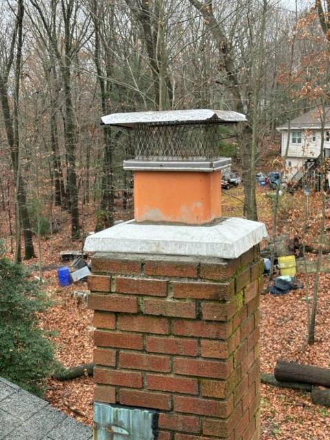 This Shelton CT high-efficiency boiler’s exhaust system was causing corrosion in the chimney, Installed a stainless steel liner properly sized to safely vent the unit.