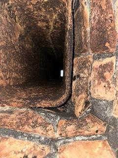 Madison Ct flue tiles deteriorated from acidic condensation.  The connector pipe was improperly pitched and ins poor shape. Installed stainless steel liner system and new heating connector pipe with a barometric damper to safely vent combustion byproducts.