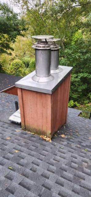 Prefabricated chimney system in Litchfield ct had rusted and deteriorated chimney pipes , chase cover , and caps. Replaced all with with rustproof stainless steel