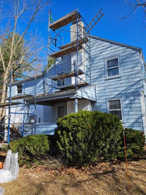 East Hartford ct painted chimney has deteriorated at a more rapid rate due to paint sealing the pores of the brick preventing moisture from escaping naturally. Need to dismantle chimney exterior halfway, rebuild chimney exterior with new specialty brick and mortar.