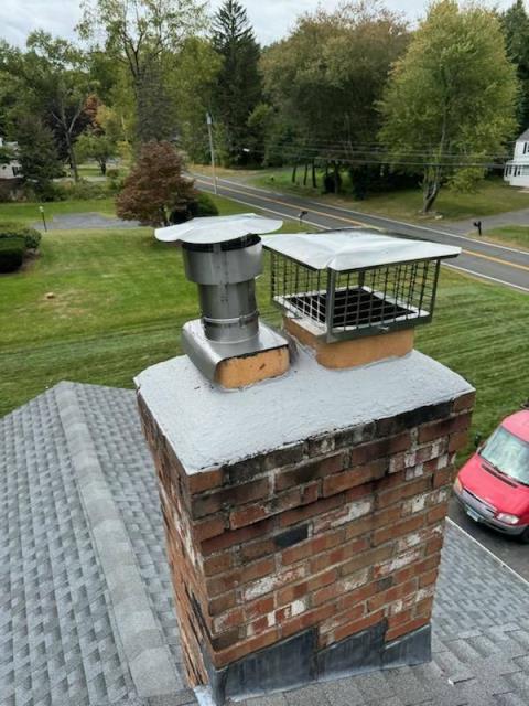 This chimney in Bloomfield had a cracked crown and no caps. Needed to install crown coat weather proof coating and two stainless steel caps to prevent water entry.
