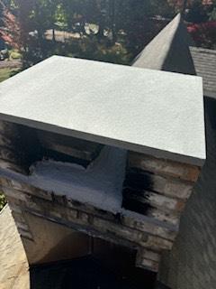 Westport CT slate chimney cap replacement – The homeowner’s slate cap had visible cracks, so we replaced it with a brand-new custom cut bluestone cover for durability and protection.
