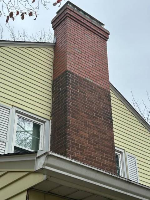 Safeside Chimney rebuilt the exterior chimney to the roofline with new brick, crown, flashing, and installed a stainless steel multi-flue cap.