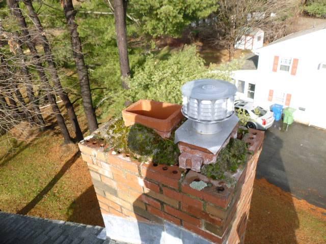 In Windsor, CT, We found the crown was completely deteriorated exposing the cored brick allowing water into chimney system.  We built a new cement crown covering and installed a chimney cap.