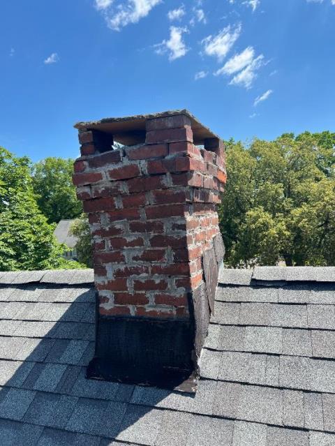 We rebuilt this severely dilapidated chimney in West Hartford, CT resolving the loose bricks, a fractured crown, failing flashing, and improper venting clearance.