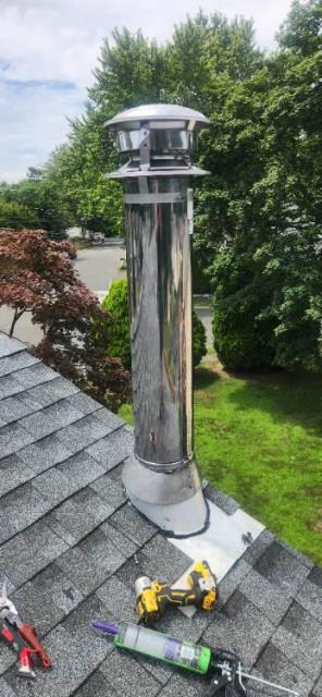 Installation of stainless steel metalbestos insulated chimney system to vent the Norwalk ct woodstove.