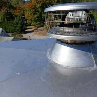This chase pan in Greenwich CT was rusted and shoddily repaired, allowing leaks and further damage to the chimney. Installed a new stainless steel chase pan and caps.