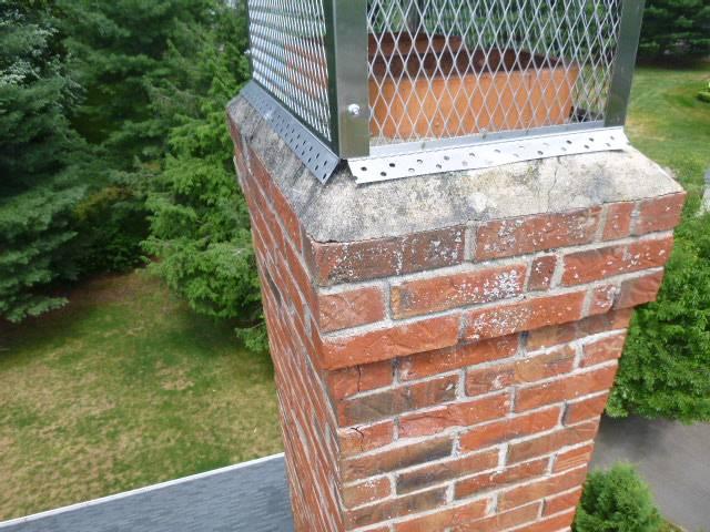 Safeside Chimney removed the chimney to the roofline, rebuilt it with new brick, cement, flashing, crown, and bluestone shoulder shelf, then reinstalled the homeowner’s stainless steel cap.