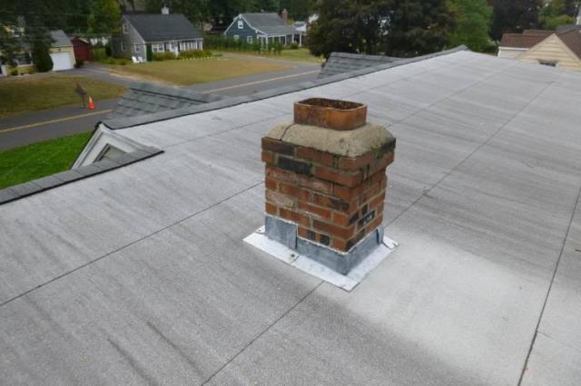 In Glastonbury, CT, did a Roof up chimney rebuild with new flashing, crown, and cap.