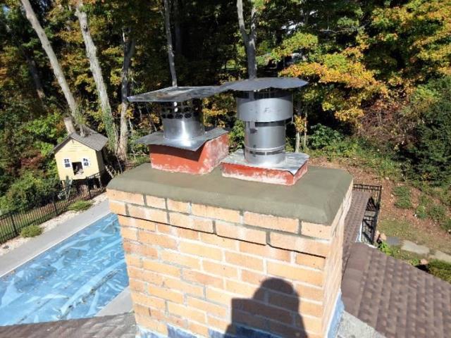 Chimney repair in Branford CT including new crown and caps.