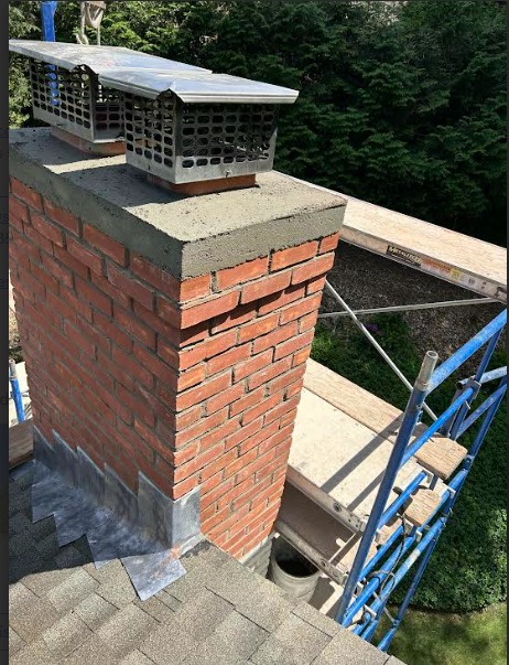 In Westport CT, The Entire Top Of The Chimney Had Sulfuric Acid and Structural Damages Developing Down to the Roofline. Once The Sulfuric Acid was Contained, the Chimney Structure Needed To Be Taken Down To the Roofline And Rebuilt With All New Brick and Cement, We also Installed Flashing, Replaced All Top Fireplace Flue Tiles / Venting System, Built Chimney Back To Existing Height and Footprint, Reconstructed New Cement Crown With Proper 2 Course Drip Edge And Reinstalled the Homeowner's Stainless Steel Caps.