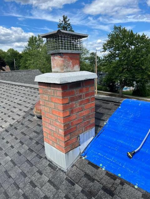 In wallingford CT, this chimney was showing space between the bricks, and was allowing acidic compounds transfer. We rebuilt the chimney from the roof up with new flashing, cap, and crown.