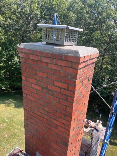 In Avon, CT, the top of the chimney is severely damaged, with loose bricks, cracked crown, failing flashing, and water entry causing structural deterioration and effloressence staining.  To prevent further damage, the entire top section must be rebuilt with new materials and proper flashing. In Avon, CT, the top of the chimney is severely damaged, with loose bricks, cracked crown, failing flashing, and water entry causing structural deterioration and effloressence staining.  To prevent further damage, the entire top section must be rebuilt with new materials and proper flashing.