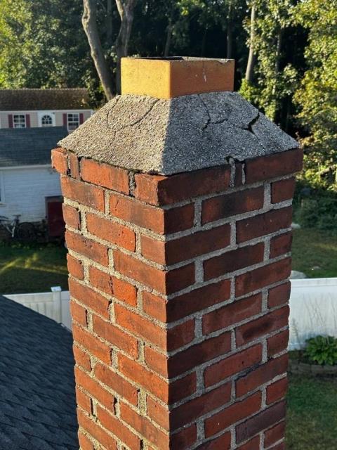 New London CT chimney rebuild with new brick and masonry, along with lead flashing.