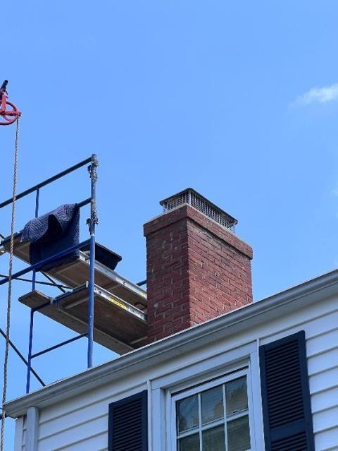 In Manchester, CT, The chimney has deteriorated from exposure to weather and freeze-thaw cycles, causing cracks and weakened mortar at the top. We recommend removing and rebuilding the top 2-4 courses with new brick and a drip edge to protect against water damage and restore structural integrity.