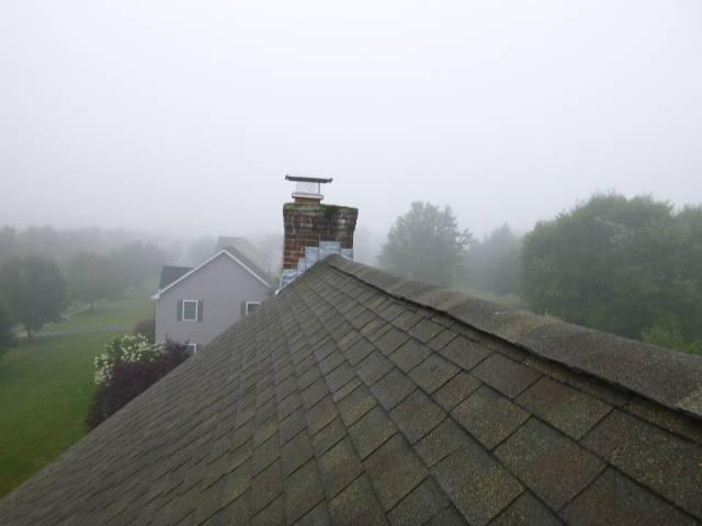 Upon arrival in Suffield CT we found the top section of the chimney severely saturated with structural damage extending down to the roofline. Loose bricks, open joints, and failing flashing indicated advanced deterioration needing full upper rebuild.