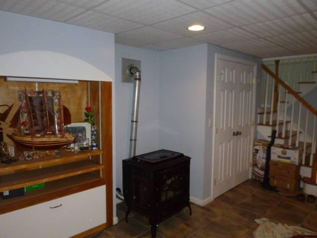 Installed a properly sized liner system to vent a Pellet stove in Middletown ct , and replaced the crooked galvanized piping with proper stove pipe.