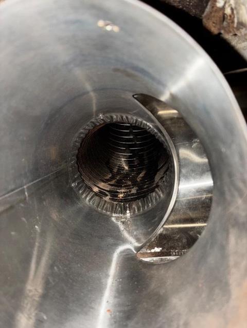In Brookfield, CT, we encountered damage to the chimney due to sulphuric acid the boiler exhaust. Installed a properly sized stainless steel 2-ply liner to increase safety and longevity of the chimney.