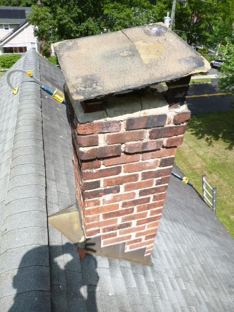 Collinsville Bluestone chimney cover collapsed and was blocking flue draft.  Top part of chimney was also deteriorated.  House is in a historical zone so expediency was required.  Rebult top few courses , new pillars and blue stone cap.