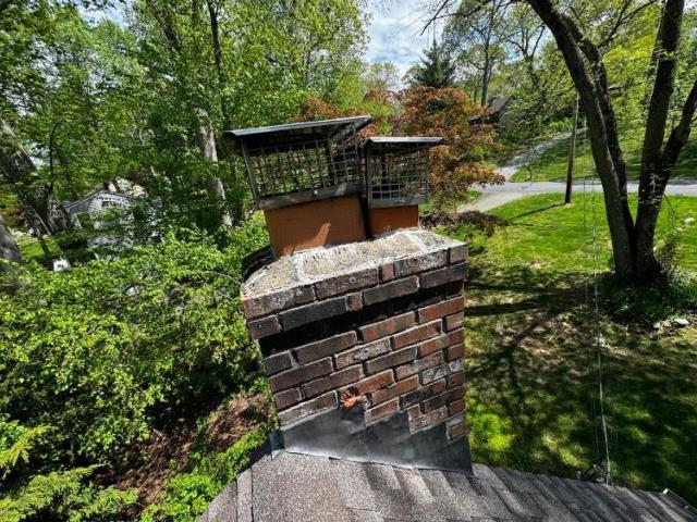 In Old Saybrook CT, We removed and rebuilt the chimney from the roof up due to extensive freeze/thaw damage and water intrusion. New flashing and crown were installed to ensure structural integrity and prevent future leaks.