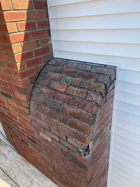 Enfield Ct Fireplace shoulder area was damaged. Common water pooling area so we rebuilt and installed a waterproof blue stone shoulder.