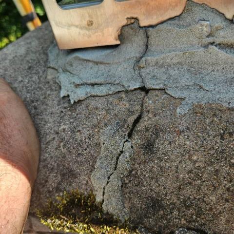 In Manchester, CT, we replaced the deteriorated chimney crown and installed new stainless steel caps to prevent water and animal entry. We cleaned the masonry and applied two coats of water repellent to protect against future moisture damage.