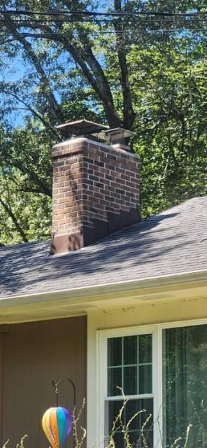 Meriden, CT, Chimney leak -  We found squirrels were actively chewing and gnawing holes through homeowner's Lead Flashing causing beginning stages of water damage in the attic area.  Replaced the counter flashing all the way around the chimney with brown stock coil.  Squirrel Proof !