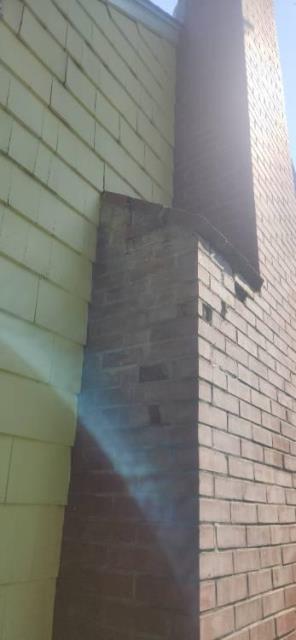In Granby, CT, we removed and rebuilt the chimney down to the flashing due to severe saturation and structural instability. The shoulder area was also rebuilt ten courses down to allow proper blue stone installation.