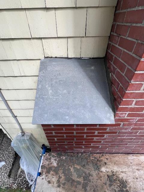 In Granby, CT, we removed and rebuilt the chimney down to the flashing due to severe saturation and structural instability. The shoulder area was also rebuilt ten courses down to allow proper blue stone installation.