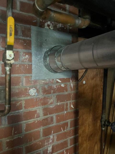 Tolland ct chimney liner system installation with new connector pipe to vent oil boiler.