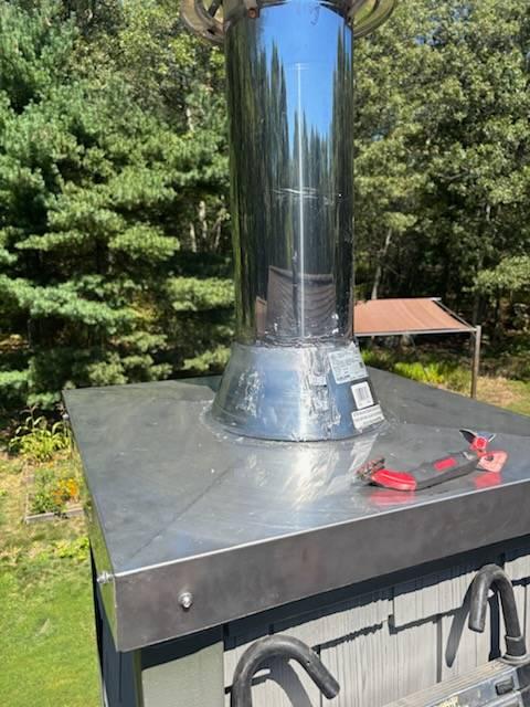 In Vernon, CT, The Front Chimney's Chase Pan is Pieced Together Sheet Metal With Silicone Used To Hold It Together. This Improperly Constructed Chase Cover Is Starting To Fail As Silicone Is Delaminating. Replaced with a new stainless steel chase pan.