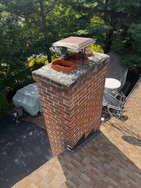 Replaced deteriorated cement crown Windsor Ct and top corbeled edge , due to water damage.  Applied commercial grade Aqua Block water repellant to protect the rest of the chimney. 