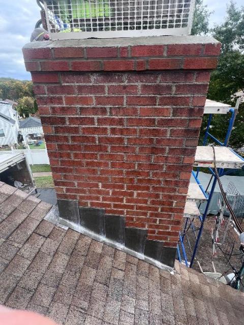 Replaced deteriorated cement crown Windsor Ct and top corbeled edge , due to water damage.  Applied commercial grade Aqua Block water repellant to protect the rest of the chimney. 