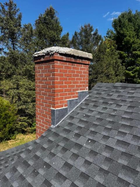 In Durham CT, We rebuilt the chimney crown and installed a new stainless steel multi-flue cap. A water repellent was applied for protection.