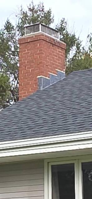 In Durham CT, We rebuilt the chimney crown and installed a new stainless steel multi-flue cap. A water repellent was applied for protection.