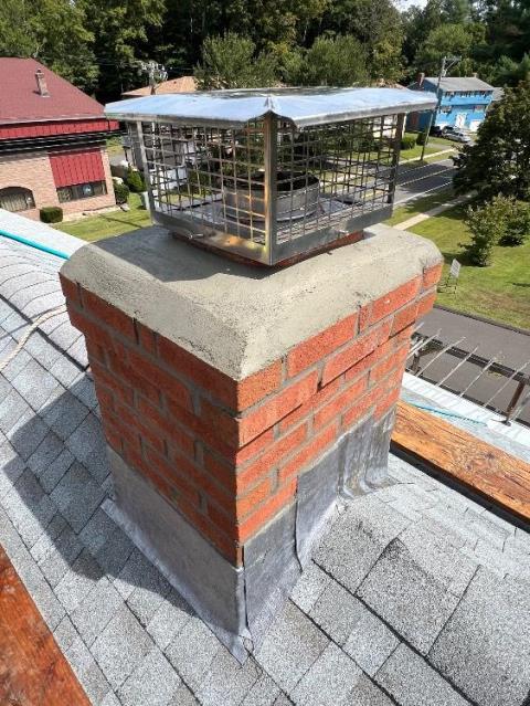 In Unionville, CT, We rebuilt the chimney from the roof up due to active leaks and structural damage caused by prolonged water intrusion. New brick, flashing, and a proper crown were installed to stop leaking and restore full integrity.