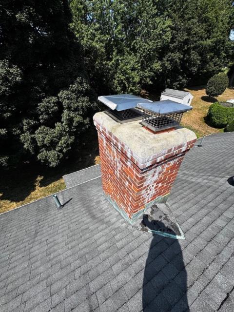 In Wethersfield, CT, We rebuilt the chimney from the roof up due to years of water damage and freeze/thaw deterioration. New brick, mortar, flue tile, and crown were installed to restore structure and prevent future leaking conditions.
